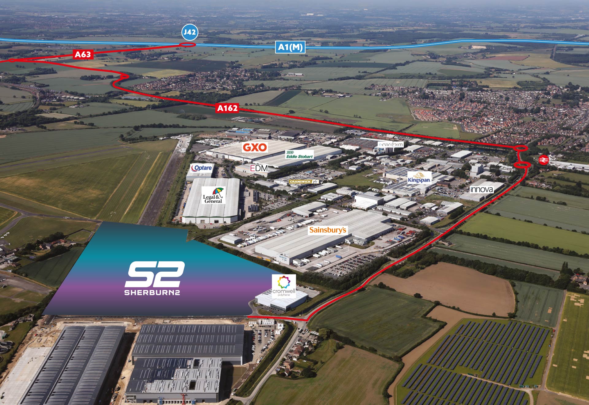 invest-strategic-sherburn Aerial photograph showing industrial units with green fields surrounding them and key transport routes in the distance.